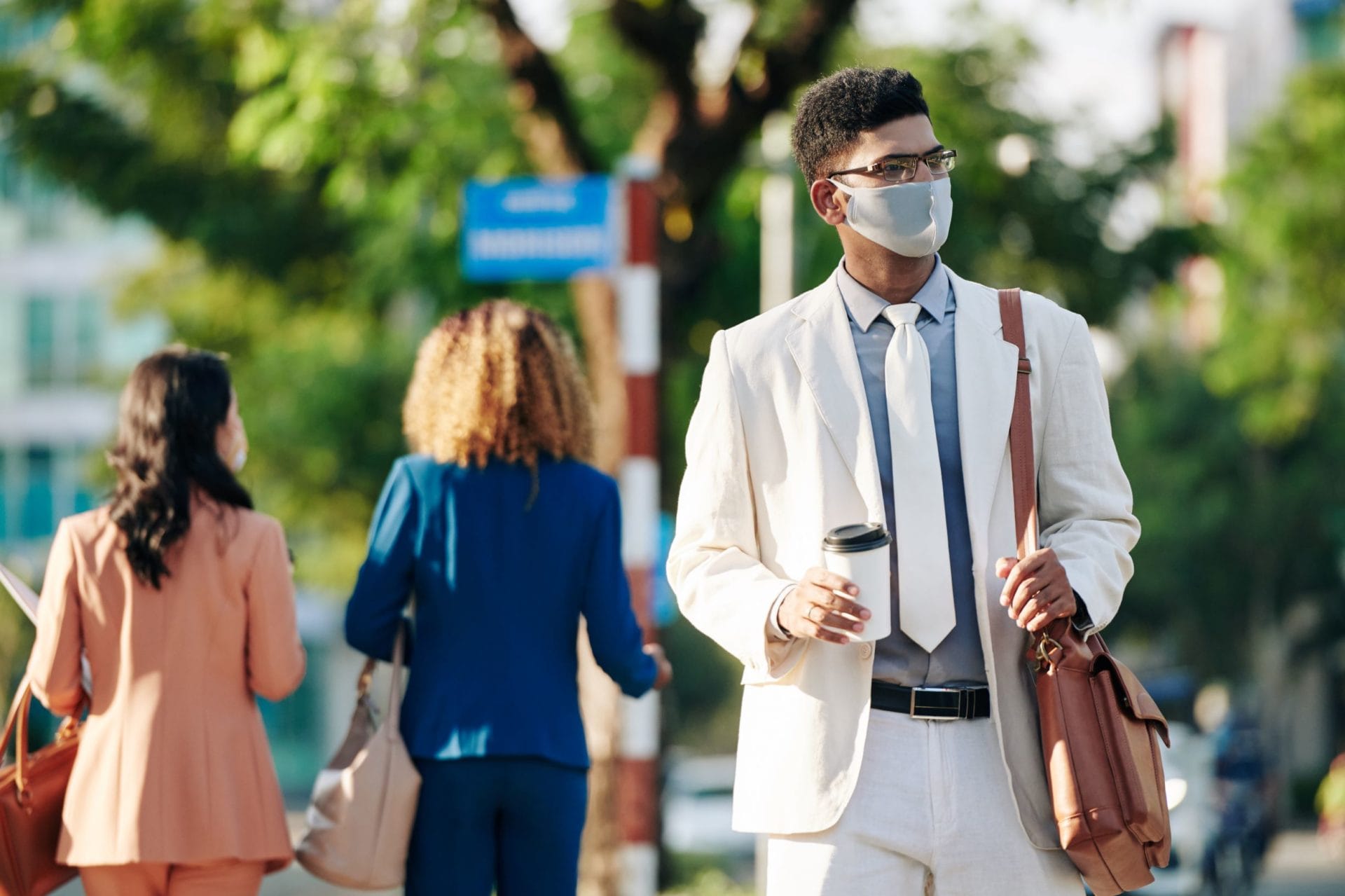 COVID to revolutionise eco-friendly business travel 2 businessman walking to work W6UELWF 2