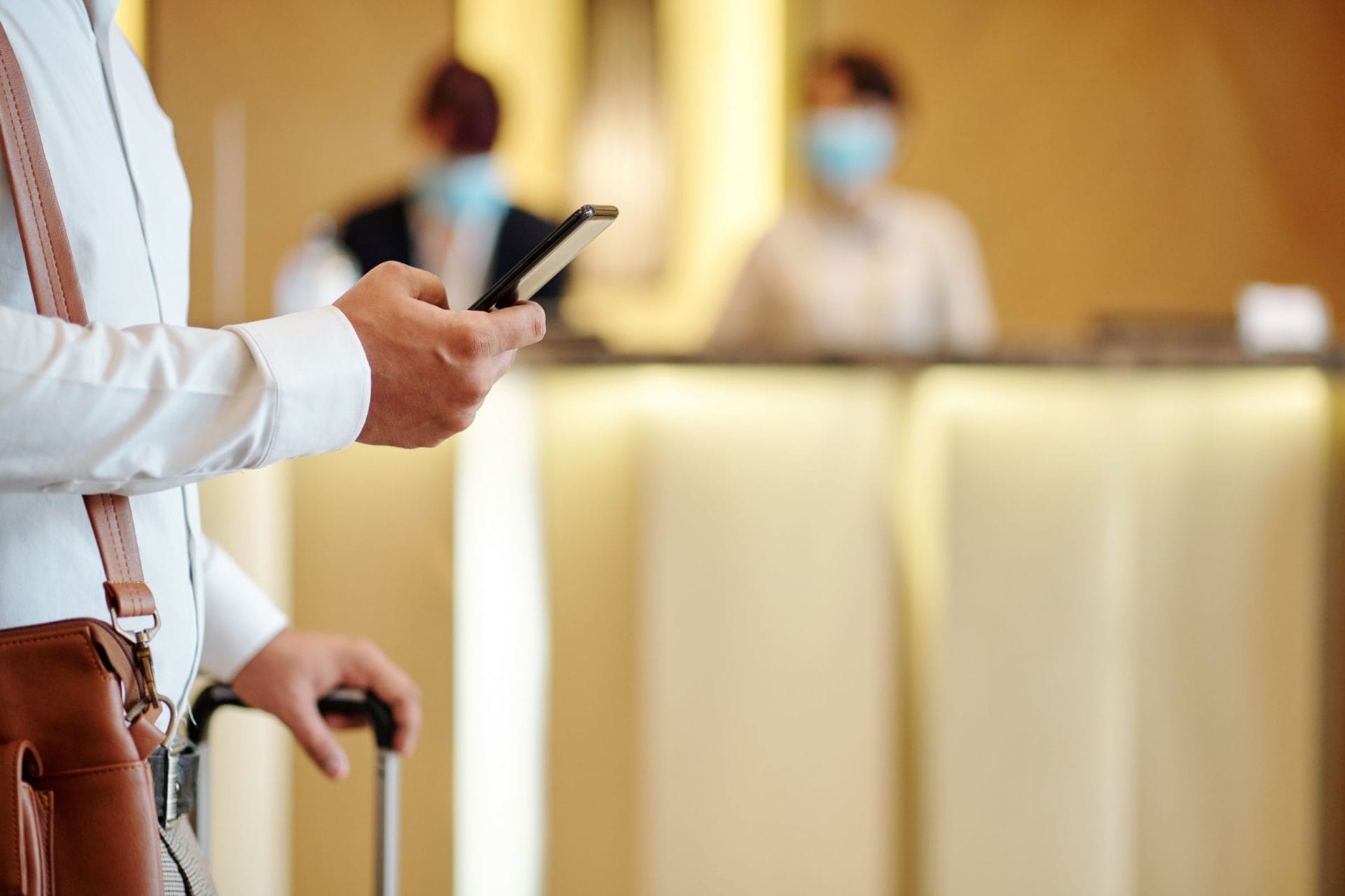 Unsustainable losses continue to mount for beleaguered hospitality industry 1 hotel guest checking phone BMC2LWH resized 1